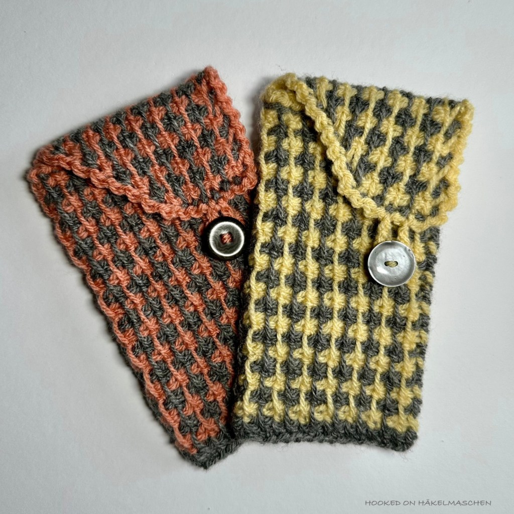 Tunisian crochet, cover for a mobile phone made with two colours, using Tunisian Simple Stich and slip stitches, creating an intricate looking pattern